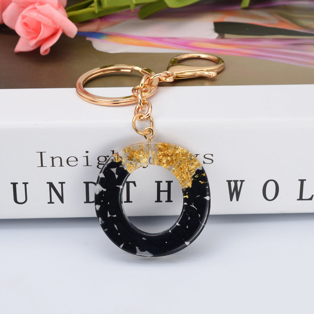 Carsine Black Pompom 26 Alphabets Keychain gold / O